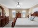 Main bedroom with king-size bed and wooden dresser at 854 Senda Plata # 22, Venice, FL 34293