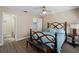 Guest bedroom with teal bedding and ensuite bathroom at 854 Senda Plata # 22, Venice, FL 34293