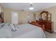 Main bedroom with king-size bed and ensuite bathroom access at 854 Senda Plata # 22, Venice, FL 34293