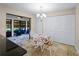 Bright breakfast nook with table and chairs, access to screened porch at 854 Senda Plata # 22, Venice, FL 34293