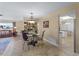 Elegant dining room with glass-top table and chandelier at 854 Senda Plata # 22, Venice, FL 34293