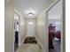 Bright entryway with tile flooring, a door, and views into other rooms at 854 Senda Plata # 22, Venice, FL 34293