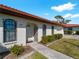 Front view of a charming home with red tile roof and wrought iron accents at 854 Senda Plata # 22, Venice, FL 34293