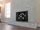 Modern fireplace with a stacked stone surround at 854 Senda Plata # 22, Venice, FL 34293