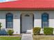 White front door with arched window and decorative iron window accents at 854 Senda Plata # 22, Venice, FL 34293