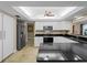Modern kitchen with stainless steel appliances and granite countertops at 854 Senda Plata # 22, Venice, FL 34293