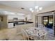 Modern kitchen featuring white cabinets and granite countertops at 854 Senda Plata # 22, Venice, FL 34293