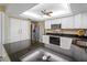 Modern kitchen with white cabinets, granite countertops, and stainless steel appliances at 854 Senda Plata # 22, Venice, FL 34293