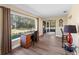 Home office with large window, wood desk, and access to a screened porch at 854 Senda Plata # 22, Venice, FL 34293