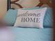 Close up of a pillow with the words 'Welcome Home' at 854 Senda Plata # 22, Venice, FL 34293