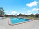 Inviting community pool with lounge chairs and surrounding homes at 854 Senda Plata # 22, Venice, FL 34293