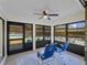 Relaxing screened porch with ceiling fan and comfortable seating at 854 Senda Plata # 22, Venice, FL 34293