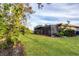 View of backyard showcasing the home's exterior and landscaping at 858 Senda Plata # 20, Venice, FL 34293