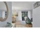 Bright and airy entryway with a view into the living and dining areas at 858 Senda Plata # 20, Venice, FL 34293