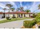Single-story home with tile roof, landscaped yard, and a curved driveway at 858 Senda Plata # 20, Venice, FL 34293