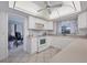 Bright eat-in kitchen with white cabinets and modern appliances at 858 Senda Plata # 20, Venice, FL 34293