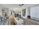 Living room with open floor plan, comfortable seating, and access to patio at 858 Senda Plata # 20, Venice, FL 34293