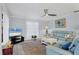 Living room with light walls, comfortable seating, and a ceiling fan at 858 Senda Plata # 20, Venice, FL 34293