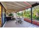Spacious covered patio with seating area and lush landscaping at 858 Senda Plata # 20, Venice, FL 34293