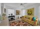 Cozy sitting room with floral sofa and large artwork at 858 Senda Plata # 20, Venice, FL 34293
