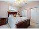 Comfortable bedroom with a double bed, wooden dresser and closet at 900 Paisley Ct # 1, Venice, FL 34293