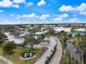 Community clubhouse and parking area with water views at 900 Paisley Ct # 1, Venice, FL 34293