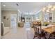 Bright dining room features a wooden table, chairs, and built-in hutch at 900 Paisley Ct # 1, Venice, FL 34293