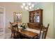 Elegant dining room with a wooden table, chairs, and chandelier at 900 Paisley Ct # 1, Venice, FL 34293