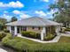 Tan villa with tile roof and lush landscaping at 900 Paisley Ct # 1, Venice, FL 34293