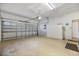 Attached garage with storage cabinets and opener at 900 Paisley Ct # 1, Venice, FL 34293