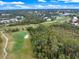 Aerial view of a golf course with lush green fairways at 900 Paisley Ct # 1, Venice, FL 34293