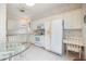 Well-equipped kitchen with white cabinets, appliances, and breakfast nook at 900 Paisley Ct # 1, Venice, FL 34293
