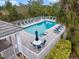 Community pool with lounge chairs and patio area at 900 Paisley Ct # 1, Venice, FL 34293