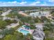 Community pool with surrounding lounge chairs and patio at 900 Paisley Ct # 1, Venice, FL 34293