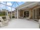 Spacious screened lanai with comfortable seating at 900 Paisley Ct # 1, Venice, FL 34293