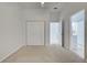 Simple bedroom with double doors leading to bath at 901 Triano Cir # 901, Venice, FL 34292