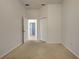 Simple bedroom with carpet, an ensuite bathroom and closet at 901 Triano Cir # 901, Venice, FL 34292