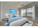 Main bedroom with water views and ceiling fan at 901 Triano Cir # 901, Venice, FL 34292