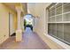 Inviting entryway with brick pavers and arched walkway at 901 Triano Cir # 901, Venice, FL 34292