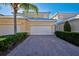 Front view of charming villa with two-car garage and landscaped entry at 901 Triano Cir # 901, Venice, FL 34292