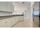 Kitchen features granite countertops and white cabinets at 901 Triano Cir # 901, Venice, FL 34292