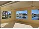 Bright sunroom with golf course views and ceiling fans at 901 Triano Cir # 901, Venice, FL 34292