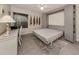 Bedroom with a wall bed, desk, and window at 936 Capri Isles Blvd # 102, Venice, FL 34292