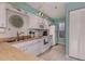 White kitchen with wood countertops and a view into the adjacent dining area at 936 Capri Isles Blvd # 102, Venice, FL 34292