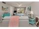 Living room with sofas, coastal decor, and sliding glass doors to patio at 936 Capri Isles Blvd # 102, Venice, FL 34292