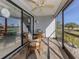 Relaxing screened porch with patio furniture at 936 Capri Isles Blvd # 102, Venice, FL 34292