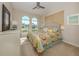 Comfortable bedroom with a king-size bed and large windows at 101 Tiziano Way, North Venice, FL 34275