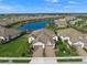 Aerial view of a luxury home community with lake access at 11204 Mcdermott Ct # 11204, Englewood, FL 34223