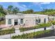 Community building with seating area and landscaping at 11204 Mcdermott Ct # 11204, Englewood, FL 34223