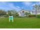 Community center with palm trees and manicured lawn at 11204 Mcdermott Ct # 11204, Englewood, FL 34223
